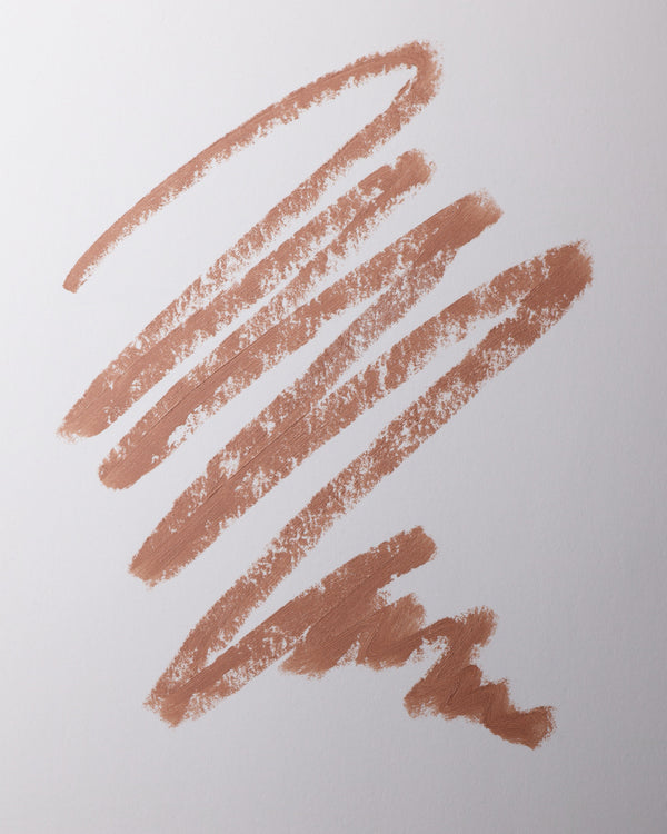 Lip liner swatch in Biscuit on grey background.