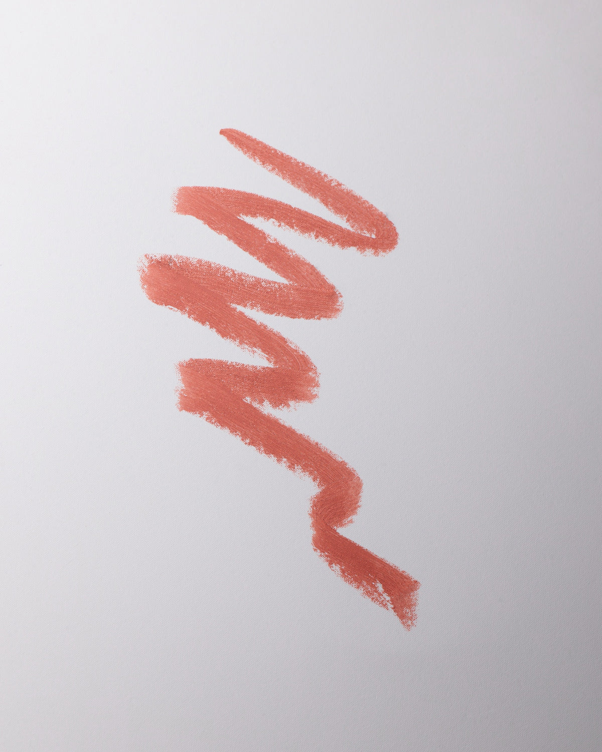 Lip liner swatch in Minou on grey background.