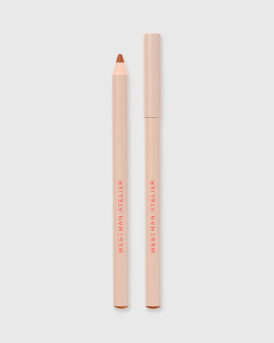 Lip liner in Sable on grey background.
