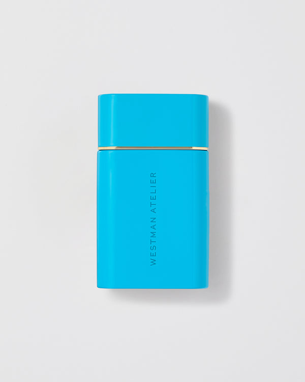 Sun Tone Bronzing Drops in a light blue bottle.
